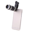 Phone with a clip-on telescope attachment on a white background