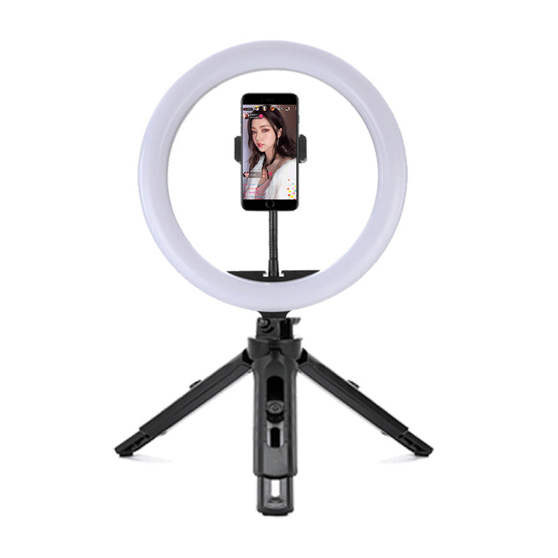 Ring light with smartphone holder on a white background