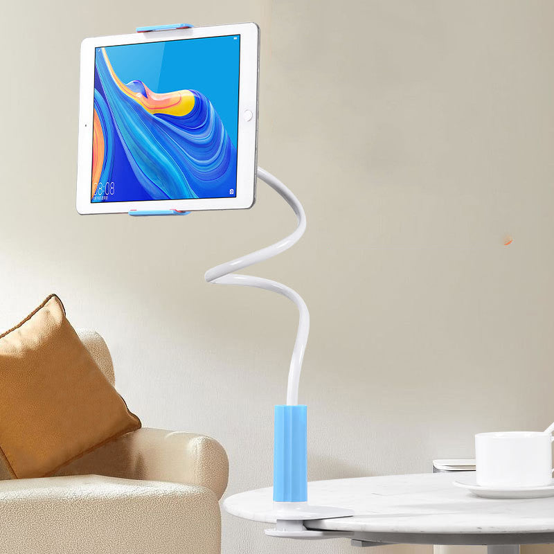 Tablet holder with a tablet on a stand in a living room setting.