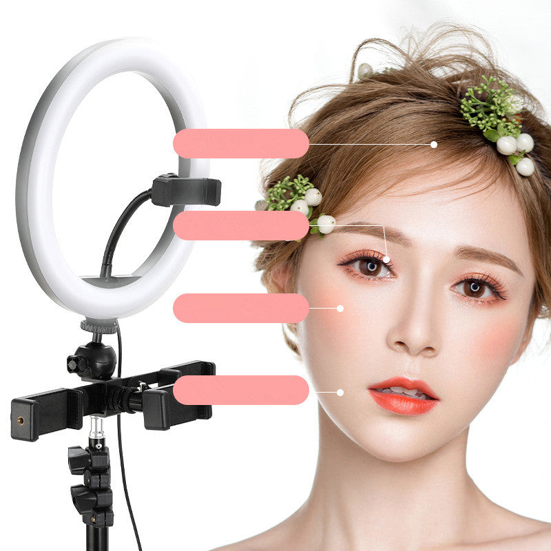 Makeup ring light with a model's face highlighted for beauty product demonstration.