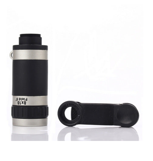 Black and silver monocular telescope with a lens cap on a white background